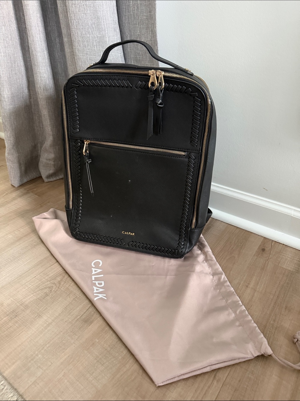Calpak Black Backpack with Gold Zippers